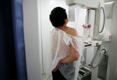 A woman undergoes a free mammogram inside Peru's first mobile unit for breast cancer detection, in Lima